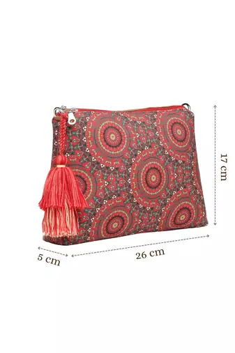 red canvas sling bag with mandala print
