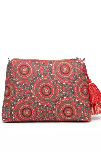 red canvas sling bag with mandala print