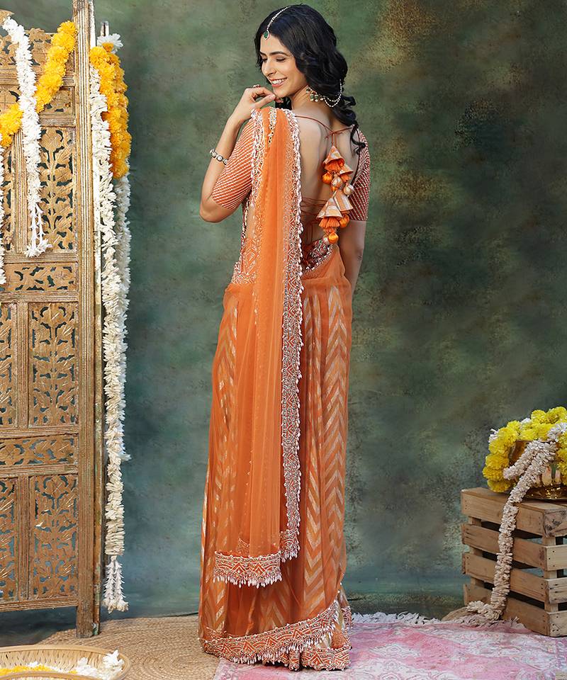 Rust orange embroidered silk saree