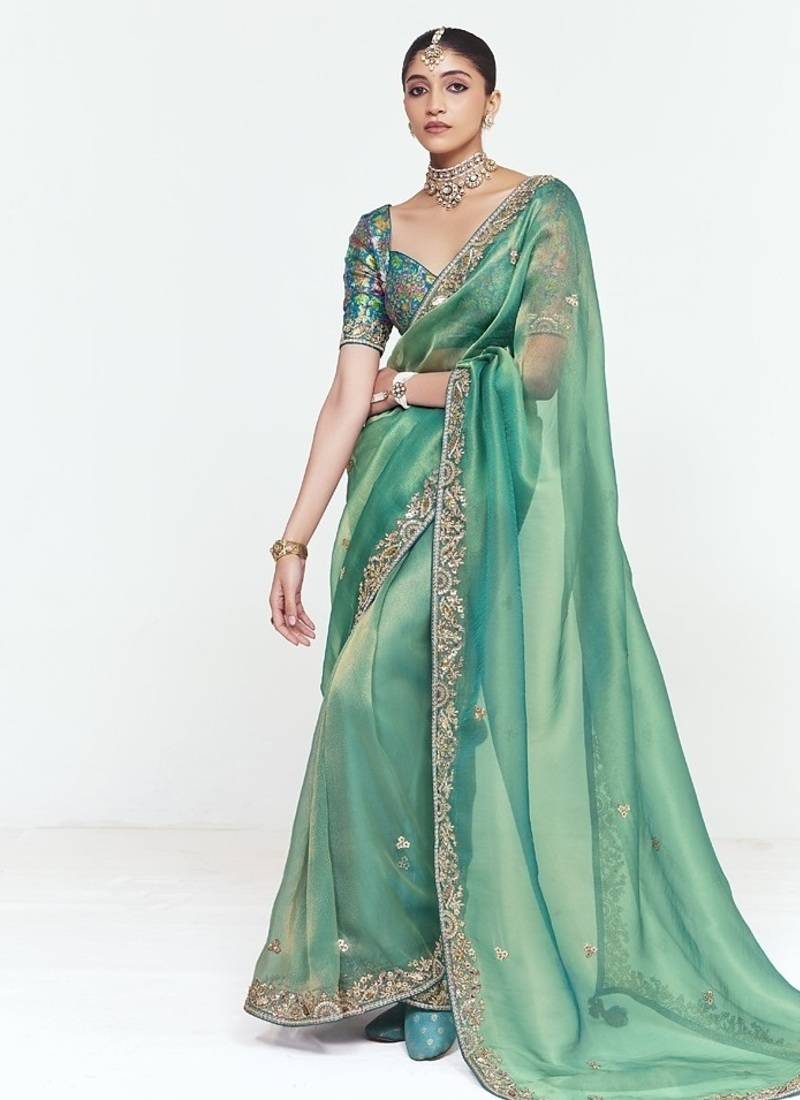 Turquise fancy beautified with sequins ,dhaga ,thread embroidered work saree