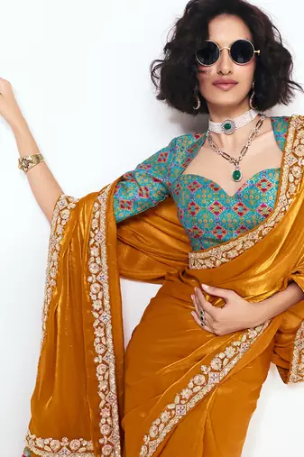 Orange fancy beautified with sequins dhaga thread embroidered work saree