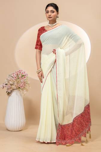 Cream georgette saree with siroski work and bandhni print pallu and blouse