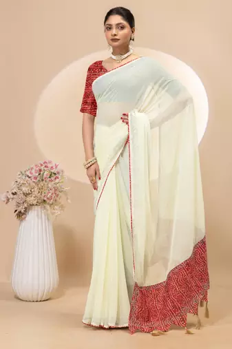 Cream georgette saree with siroski work and bandhni print pallu and blouse