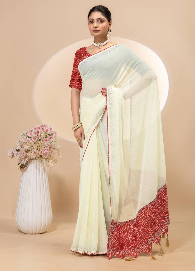 Cream georgette saree with siroski work and bandhni print pallu and blouse