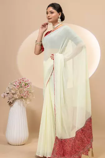 Cream georgette saree with siroski work and bandhni print pallu and blouse