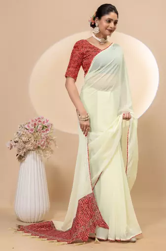 Cream georgette saree with siroski work and bandhni print pallu and blouse