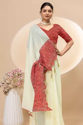 Cream georgette saree with siroski work and bandhni print pallu and blouse