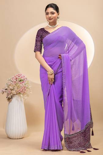 Purple georgette saree with siroski work and bandhni print pallu and blouse