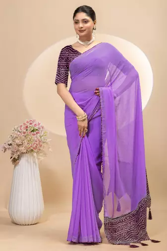 Purple georgette saree with siroski work and bandhni print pallu and blouse