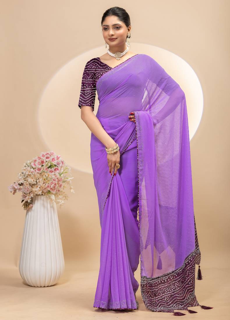 Purple georgette saree with siroski work and bandhni print pallu and blouse