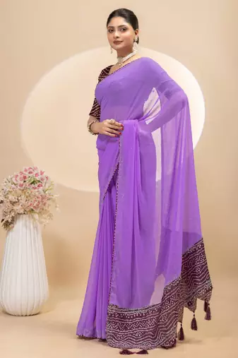 Purple georgette saree with siroski work and bandhni print pallu and blouse