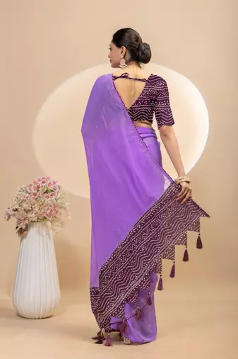 Purple georgette saree with siroski work and bandhni print pallu and blouse