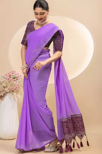 Purple georgette saree with siroski work and bandhni print pallu and blouse