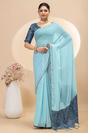 Sky blue georgette saree with siroski work and bandhni print pallu and blouse
