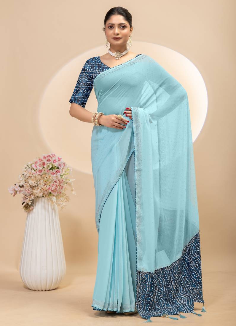Sky blue georgette saree with siroski work and bandhni print pallu and blouse