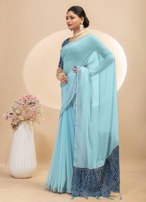 Sky blue georgette saree with siroski work and bandhni print pallu and blouse 2