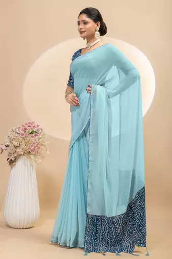 Sky blue georgette saree with siroski work and bandhni print pallu and blouse