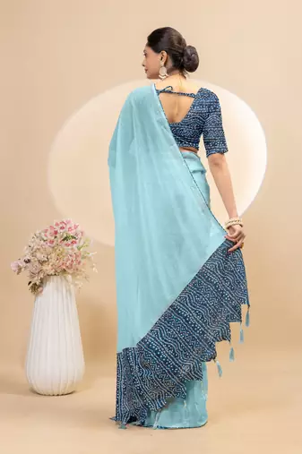 Sky blue georgette saree with siroski work and bandhni print pallu and blouse