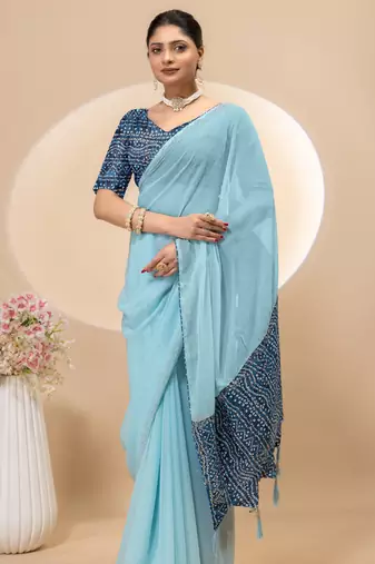 Sky blue georgette saree with siroski work and bandhni print pallu and blouse