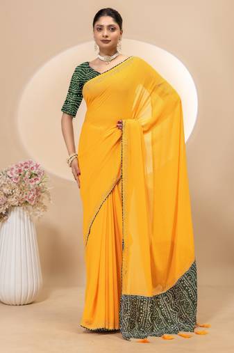 Yellow georgette saree with siroski work and bandhni print pallu and blouse