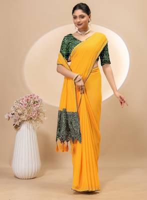 Yellow georgette saree with siroski work and bandhni print pallu and blouse 4