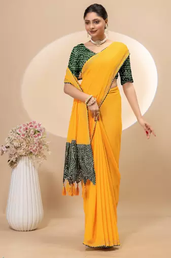 Yellow georgette saree with siroski work and bandhni print pallu and blouse