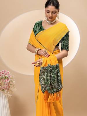 Yellow georgette saree with siroski work and bandhni print pallu and blouse 5