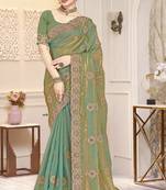 Green color heavy coding zarkan embroidered work satin silk saree sari