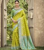 parrot green color banarasi silk blend fabric ethnic woven designer saree