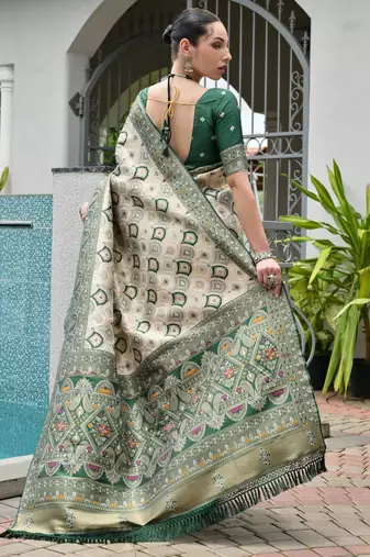 green woven partywear saree