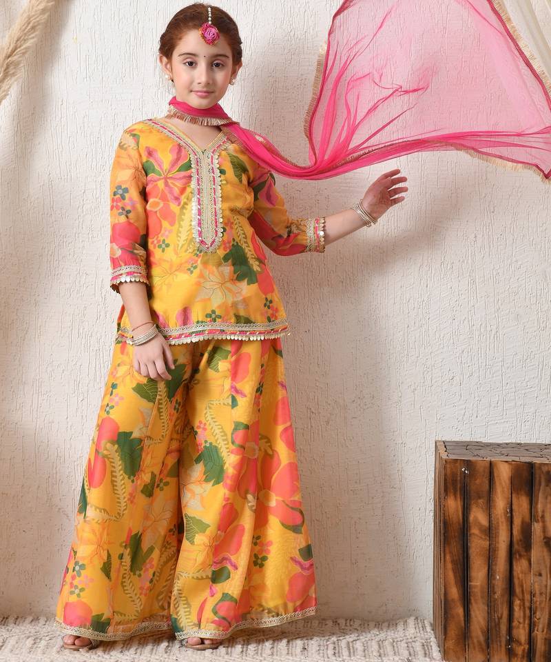 Girls' bright yellow floral printed sharara set with pink dupatta     festive ethnic wear for girls ilksd13