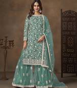 Turquoise net heavy thread embroidery with sequins work palazzo suit