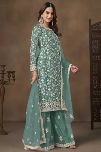 Turquoise net heavy thread embroidery with sequins work palazzo suit