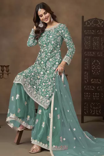 Turquoise net heavy thread embroidery with sequins work palazzo suit