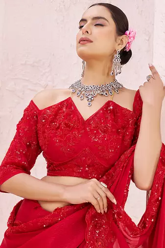 Red embroidered crepe saree