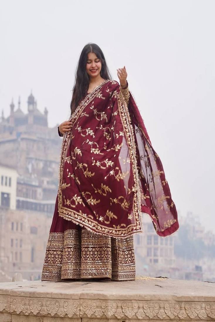 maroon faux georgette gown with full heavy embroidery  