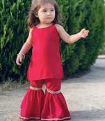 Red sleeveless top and flared pants set