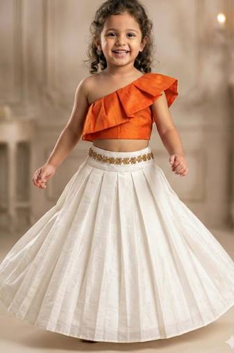 Orange one-shoulder top with ivory skirt