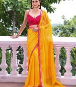 Sun yellow chiffon saree with pink accents