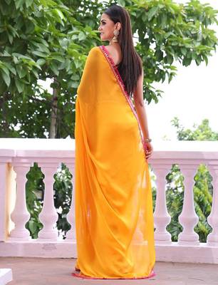Sun yellow chiffon saree with pink accents 2