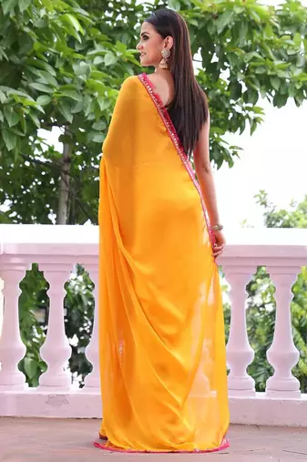 Sun yellow chiffon saree with pink accents