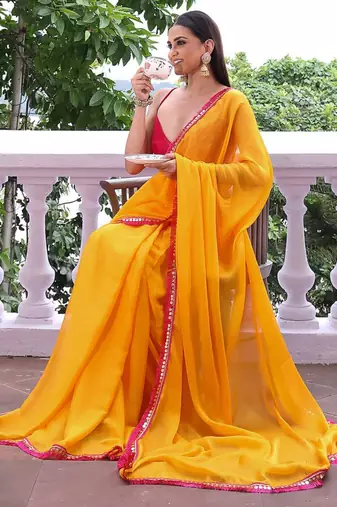 Sun yellow chiffon saree with pink accents
