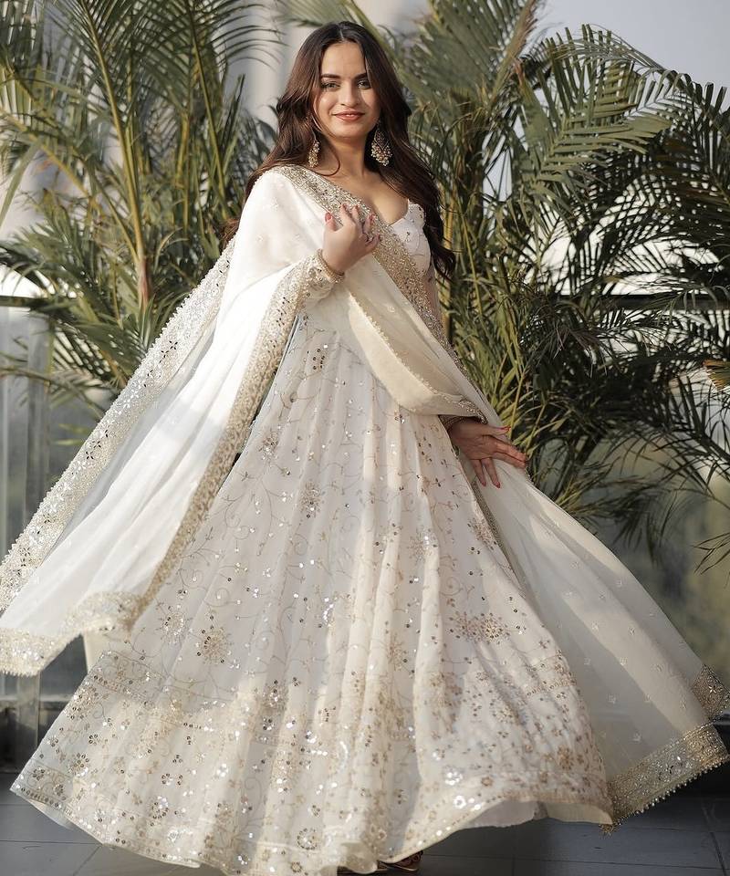 Designer ivory faux georgette party wear gown with heavy sequin work