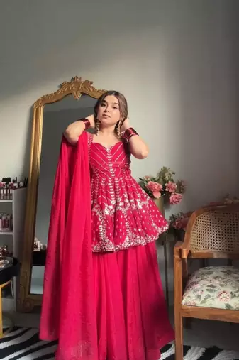 Pink faux blooming peplum sharara set with heavy sequins & multi zari thread embroidery