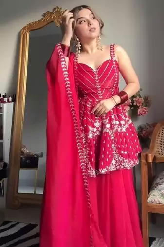 Pink faux blooming peplum sharara set with heavy sequins & multi zari thread embroidery