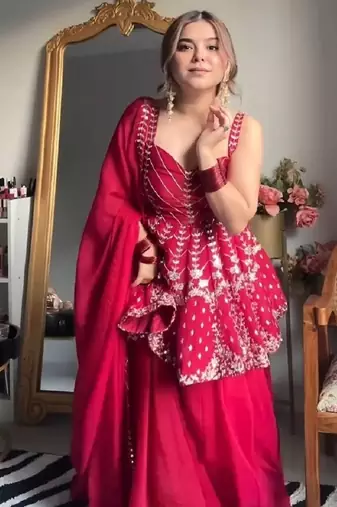 Pink faux blooming peplum sharara set with heavy sequins & multi zari thread embroidery