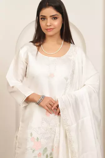 White embroidery work cotton blend kurta trousers with dupatta.
