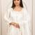 White embroidery work cotton blend kurta trousers with dupatta.