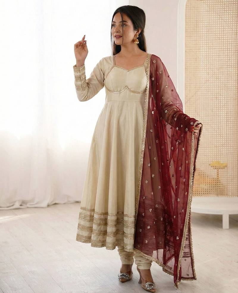Cream silk blend anarkali with maroon contrast dupatta