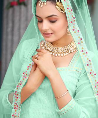  mint green ethnic dress material set featuring delicate floral embroidery with skirt & dupatta 3